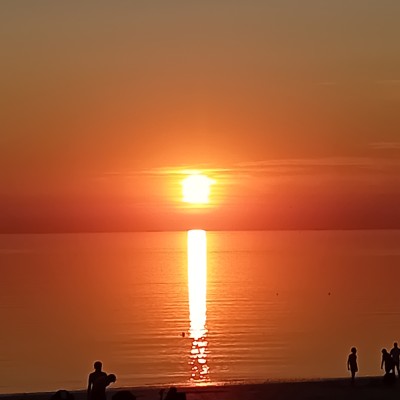 De zon zien zakken in de zee