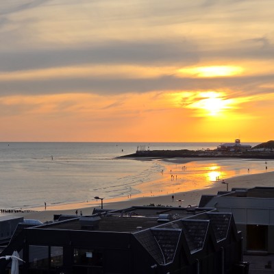 Ondergaande zon strand Vlissingen